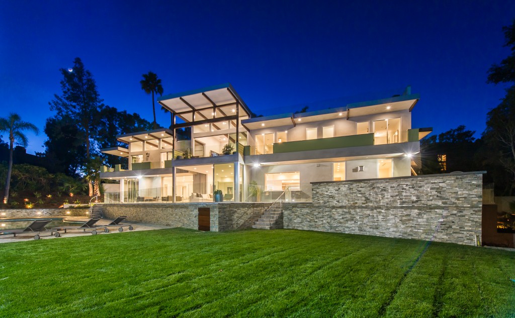 This architectural home featuring walls of glass and decks sits on almost half an acre. Photo: Marc Angeles