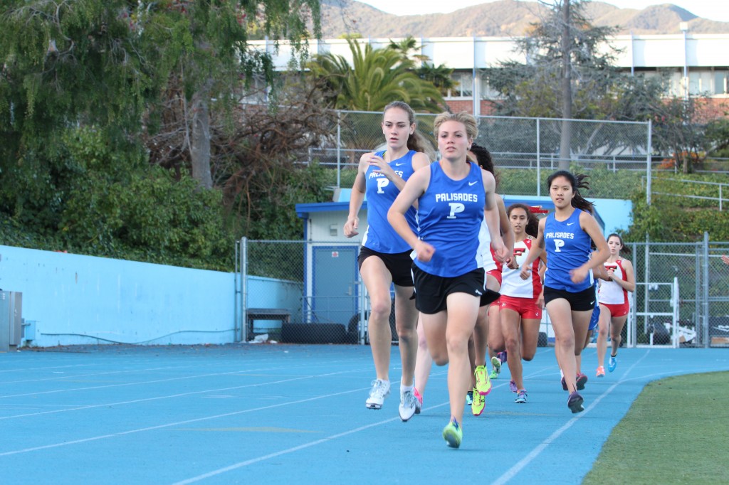 Palisades High junior Marissa Williams (front) won the 1,600 meters at last Friday’s tri-meet against Taft and Carson. Photo: Rick Steil 