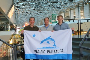 (Left to right) Rich Cronin, John Emerson (U.S. Ambassador to Germany) and Matt Cronin hold the new Palisades flag in Germany. Photo courtesy of Rich Cronin