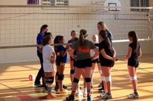 Bridget Hearst (left) listens as former coach and Sunshine Volleyball Club founder Cari Klein (right) talks to her 12-Elite team, which played in a Junior National qualifier in St. Louis. Photo courtesy of Bridget Hearst