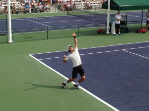 Pictured at right, Novak Djokovic takes a swing during the BNP Paribas Open. Photo: Natasha Mandich 