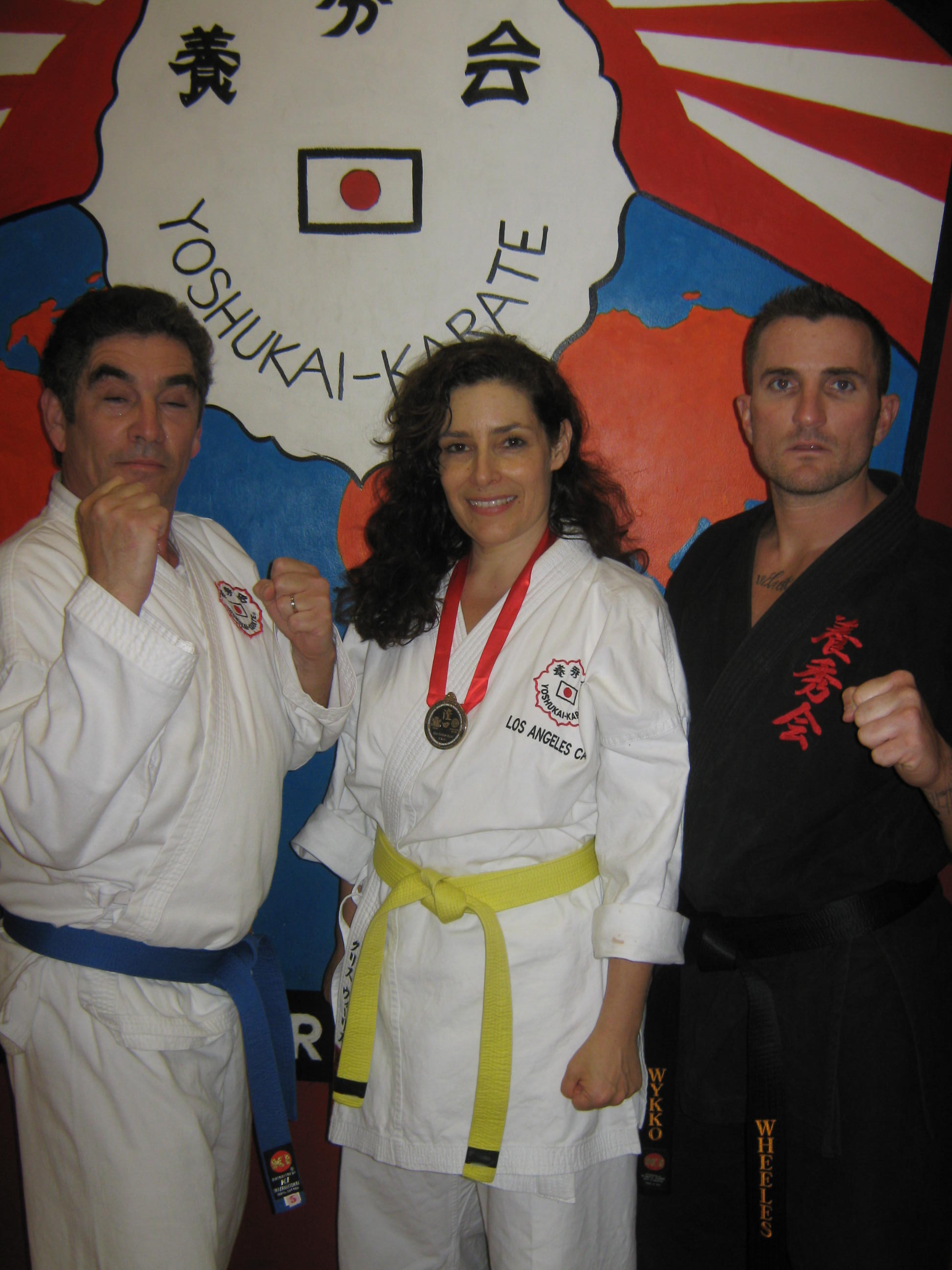 Tamar Springer with fellow Kata winners Carl Fredlin (left) and Chris Wheeles (right) at the 45th annual All-Star Karate Tournament.