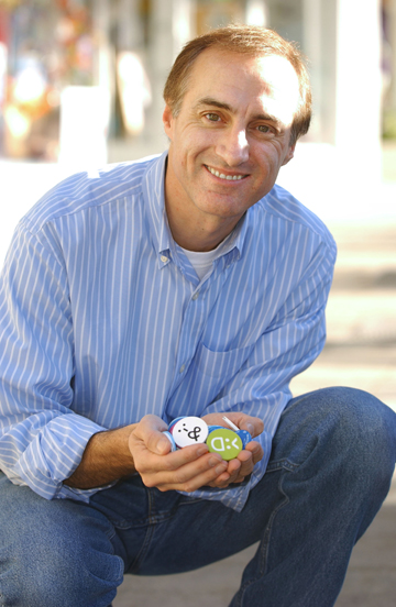 Pacific Palisades resident George Zaloom has created Facechipz, a closed networking Web site for tweens. He holds the chipz that must be physically exchanged in order for young friends to communicate on a personalized Web page. Rich Schmitt/Staff Photographer