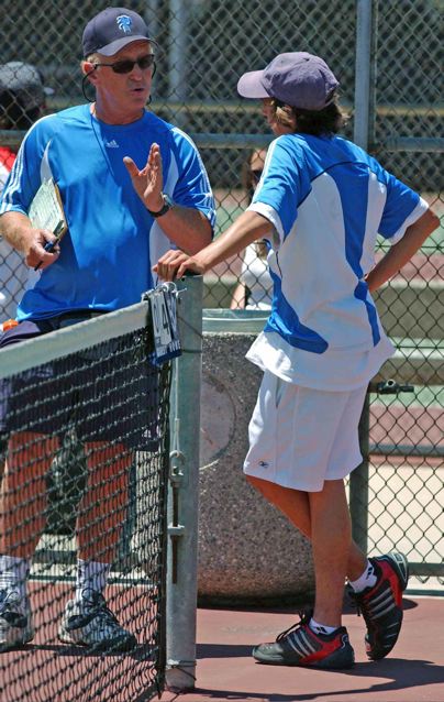 Palisades Coach Bud Kling offers advice to singles player Justin Atlan during a changeover at the City Section boys' tennis finals Friday in Encino.