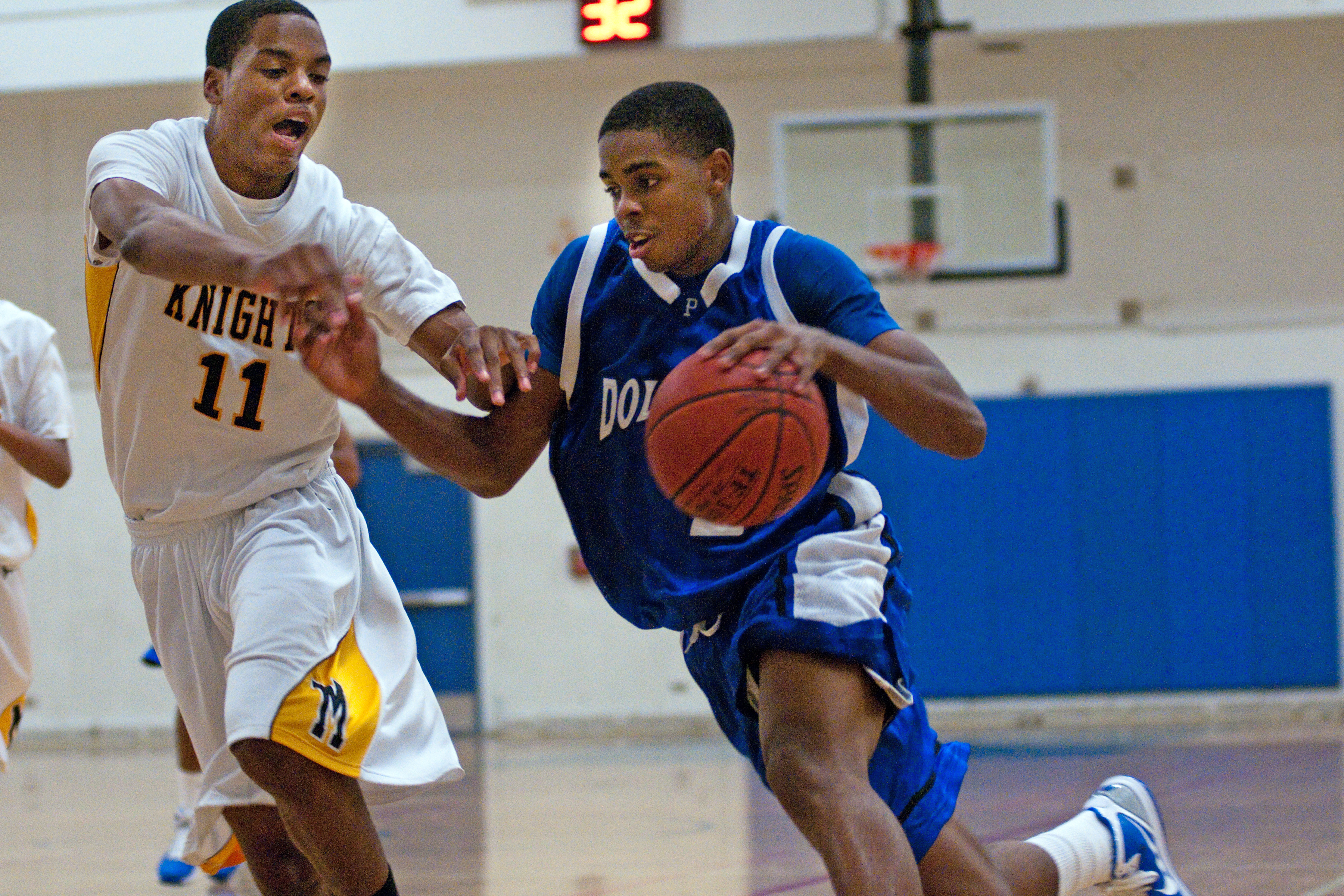 Palisades' Donovan Johnson drives to the basket around a Bishop Montgomery player during last week's Santa Monica Tournament.  Photo: Morgan Genser