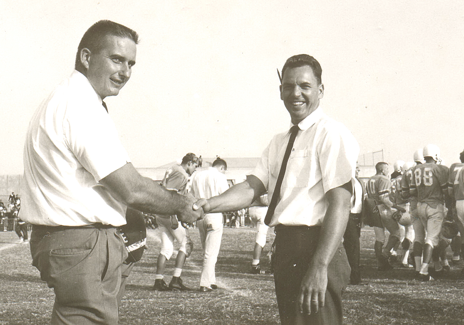 Co-coaches Dick North (left) and Merritt Stanfield congratulate each other after Palisades' first varsity football victory in 1962. Photo: Barry Vernon (Class of '63)