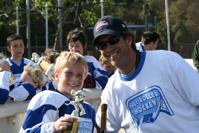 Scoring champion Finn O'Rourke (left) with Palisades Recreation Center roller hockey founder Ethan Rill.