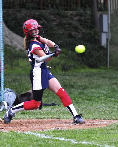 Sixth-grader Jackie Carr makes contact during the Falcons' 6-4 victory over Windward that clinched their fifth straight league title.   Photo: John Beaver