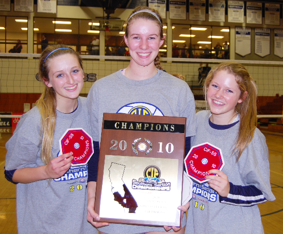 Palisadians (from left) Lanti Moye-McLaren, Taylor Bantle and Christine Irvin display their CIF patches and the championship plaque after leading Marymount High to the Division I-A volleyball title at Cypress College. Photo: Kim Bantle