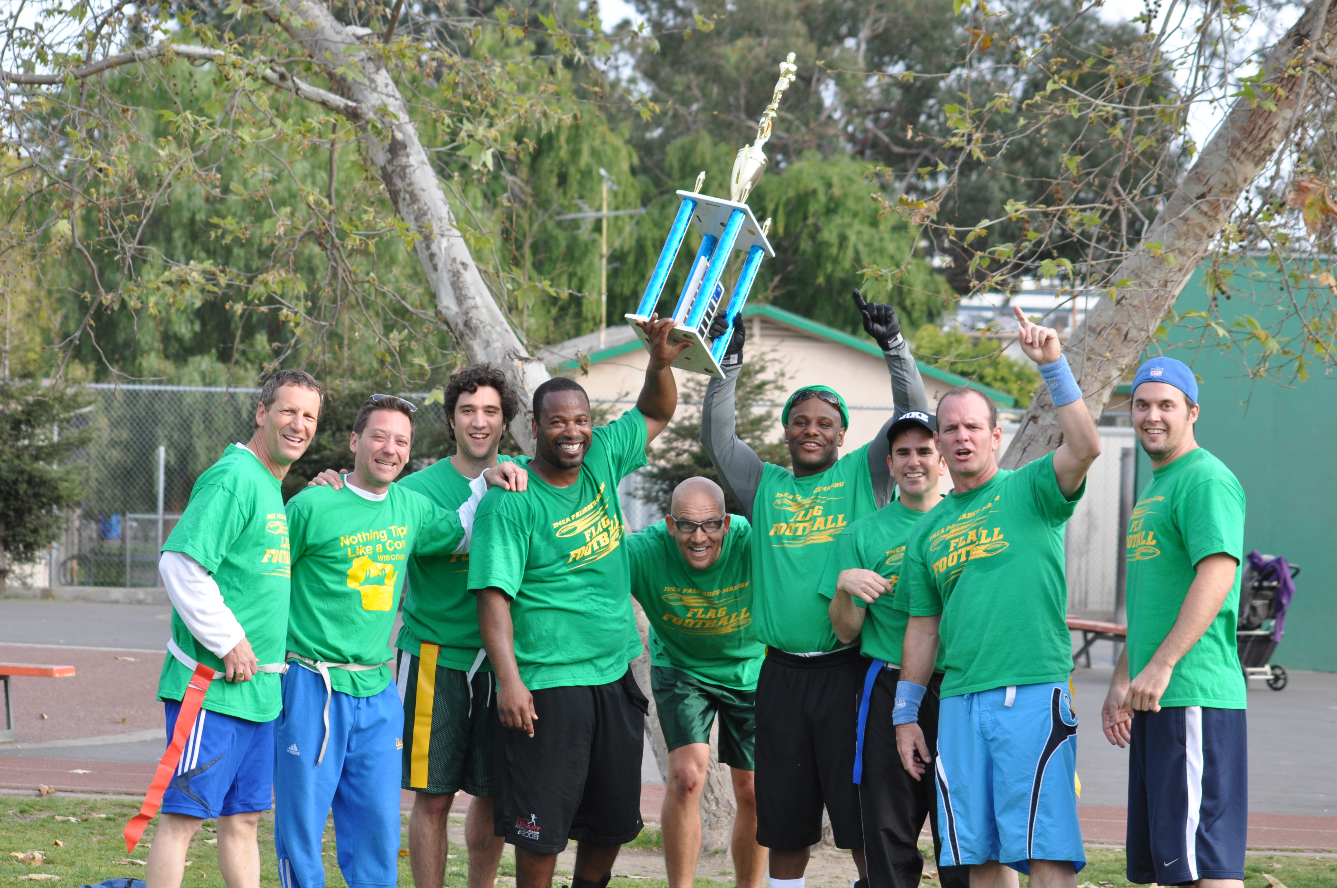 Green Machine players celebrate with the championship trophy after their 28-7 victory over Team White at Brentwood Science Magnet. Photo: Gabriel Soufo.