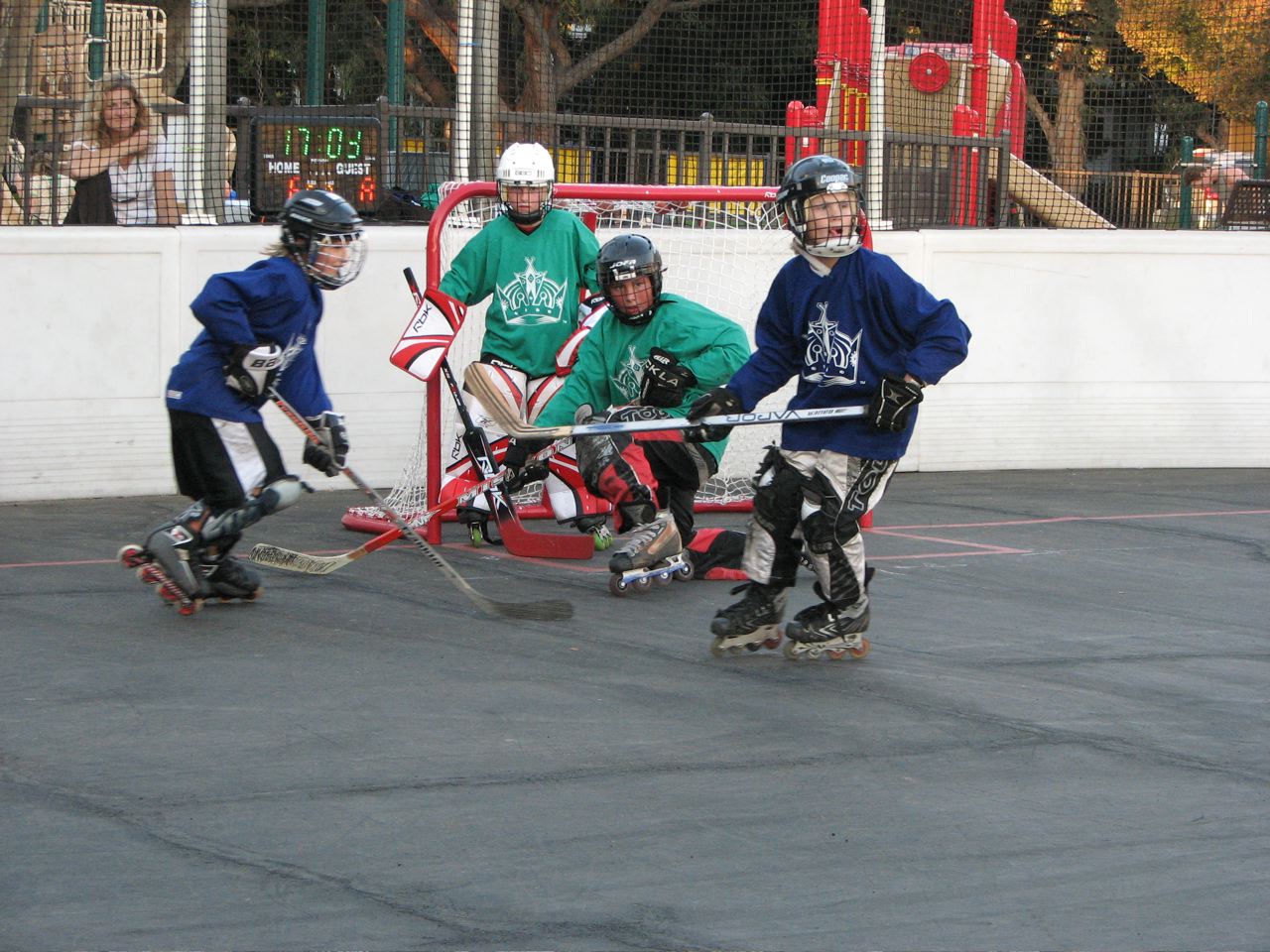 Action from Saturday's roller hockey game between Green and Blue. Kelly Harlan and James Kahn each scored eight times in Blue's 17-12 victory. Chet Burrows scored 11 goals for Green. Photo: Joyce Harlan