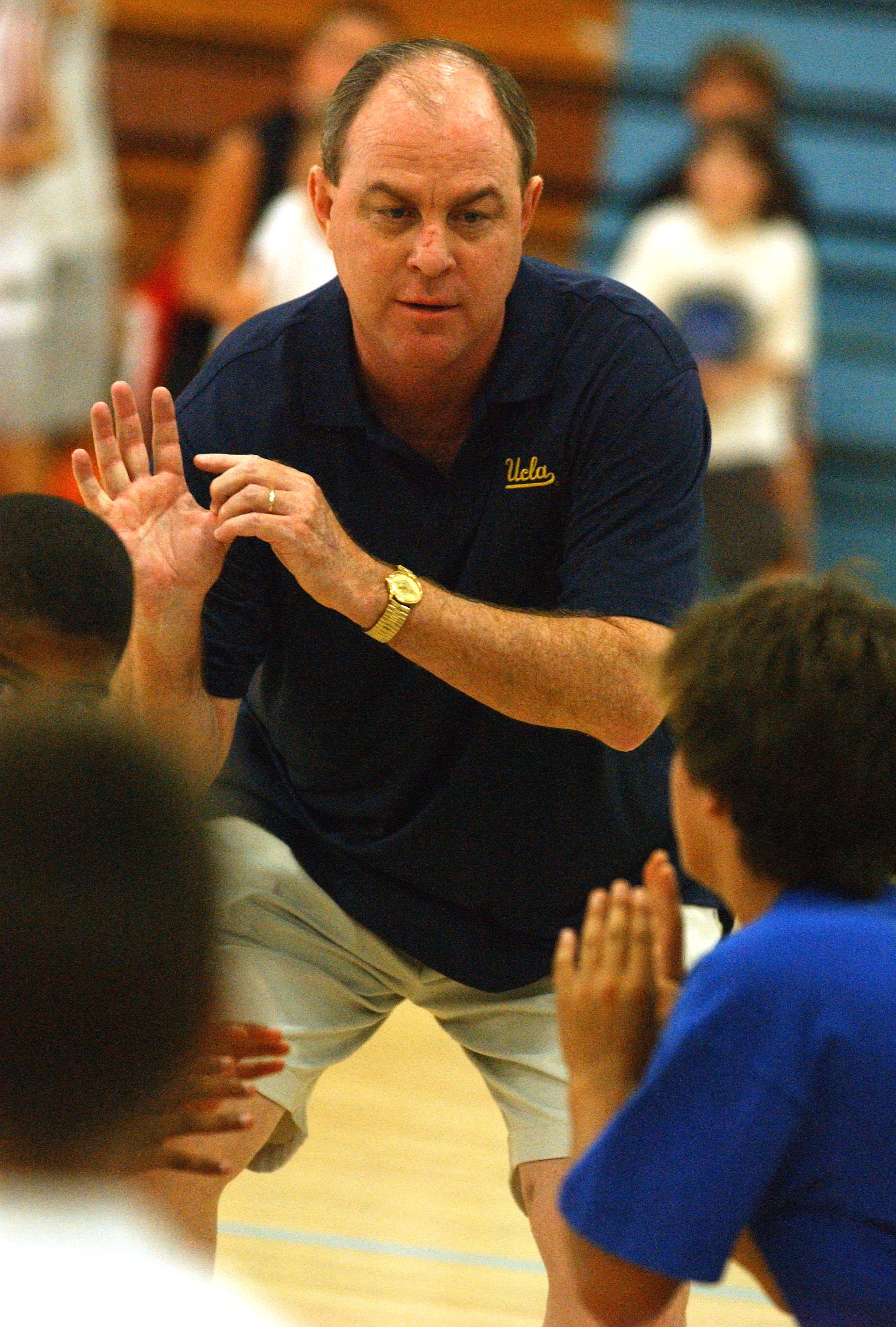 UCLA men's basketball coach Ben Howland demonstrates how to shoot during a youth camp held at Palisades High in July--one of many memorable events that took place in the Palisades in 2006.