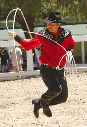 Defying gravity with deft footwork and careful twirls, one of the country's top trick ropers, Felix Lopez, awes spectators at the Will Rogers Jubilee sponsored by California State Parks.