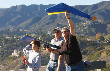 Graham McMillan, a fifth grader at Village School, Jim Breese (center) and Kerry Feltham prepare to release their Zagi wings into the wind.
