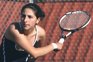 Dalia Shamsian prepares to slice a backhand return in Palisades' Western League opener against LACES last Wednesday. She and Katie Pfannkuche won 8-1 at No. 3 doubles.