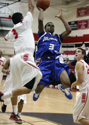 Palisades guard Donovan Johnson (3) takes to the air for two of his season high 29 points on Monday night at Westchester.    Photo: Margaret Molloy