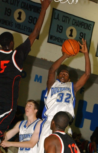 Junior Irvin Kintaudi shoots a jumper over Westchester