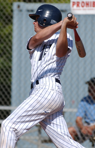 Garrett Champion smacks the game-ending double in Palisades' 10-0 victory over Fairfax. The Dolphins finished 15-0 in league.