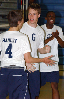 Palisades players (from left) Matt Hanley, Henry Conklin and Kene Izuchukwu celebrate a kill against Hamilton last Thursday.