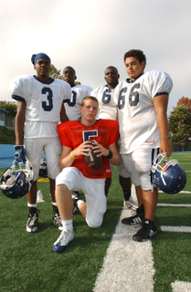 Tanqueray Towns, Chris Chukwuocha, Bryce Williams and Joe Brandon surround quarterback Conner Preston.