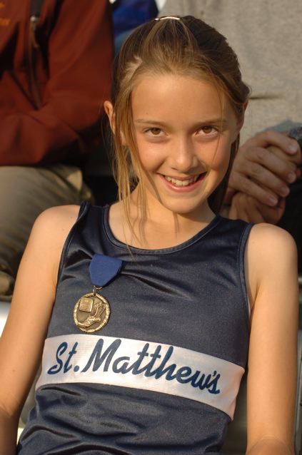St. Matthew's seventh-grader Cami Chapus wears her medal proudly after setting a school-record in the 800 meters at the Delphic League track finals. Photo: Victoria Chapus
