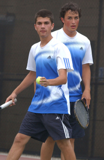 Palisades' Kramer Waltke (with ball) and partner Che Borja won the City Individual doubles tennis title Monday in Encino.