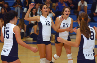 Palisades High players (left to right) Sam Jaffe, Laura Goldsmith, Meghan Middleton and Lauren Gustafson celebrate a winning point against West Adams Prep in last Thursday's playoff opener.