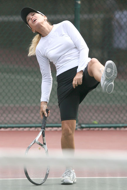 Actress Donna Mills reacts moments after hitting a volley inches wide in last Sunday's second annual 