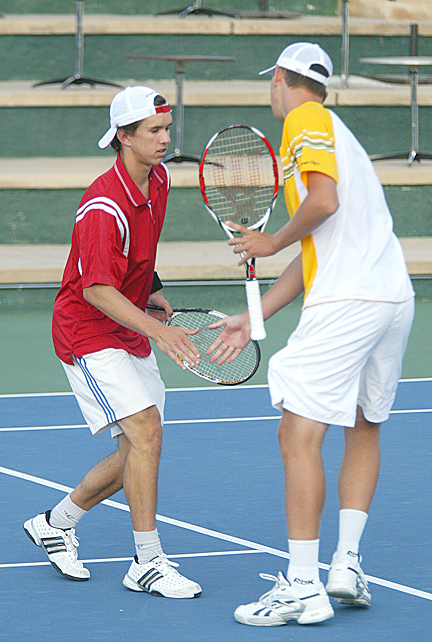 Palisadian Walker Kehrer (left) low-fives doubles partner Kyle McMorrow during the Boys 16s final at the Easter Bowl last Sunday in Rancho Mirage. Photo by David Kenas