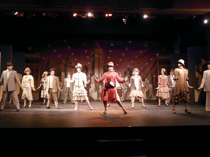 Millie Dillmount (Krystal Jasmin Combs), center, and chorus in the opening scene of 