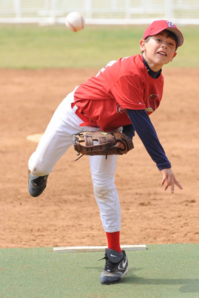 Christian Gambale hurls a strike in the Cardinals' 9-8 Mustang Division victory over the Cubs.