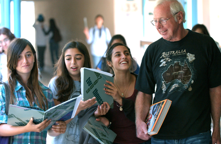 Stolper, who retired in June after 27 years of teaching, visits with his eighth-grade students at Paul Revere.