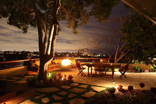 Evening turns magical as the lights below ignite a spectacular view.  Photo: Orly Olivier Photography