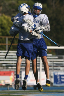 JV teammates Ryan Angelich (left) and Danny Bailey celebrate a goal against Loyola. The Dolphins finished undefeated and won the City Section varsity title.