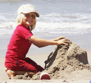 Making sandcastles is all part of the fun at Sandy Days Kids Camp at Will Rogers State Beach.