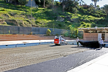 By Monday, workers had nearly filled in the Temescal pool. Above, they prepare to put soil on top of the gravel already in the pool.