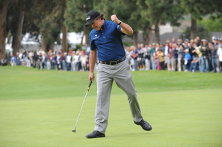 Phil Mickelson pumps his fist after sinking an eagle putt on the first hole of Sunday's final round of the Northern Trust Open at Riviera. 