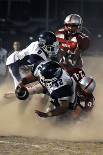 Joe Brandon (#42) stretches the ball over the goal line with help from Ben Ingram for Palisades' only touchdown of Friday night's game at Hollywood.