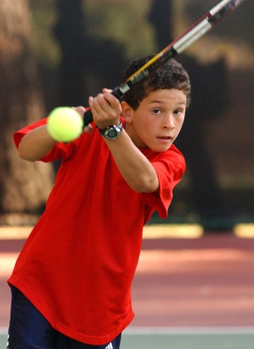 Eduardo Nava rips a backhand on his way to an 8-6 victory during the PTC Open team's win over L.A. Tennis Club.