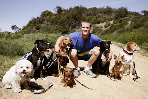 Pacific Palisades native Colin West with his friendly and attentive doggy pack.