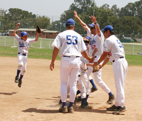 Jack Brew (left) jumps for joy as coaches and teammates celebrate after the Palisades All-Stars beat East Long Beach to reach the Pinto Sectionals.