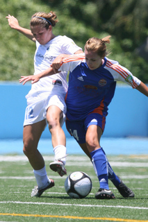 Kelly O'Hara (left) battles a defender for the ball. The Pali Blues have repeated as W-League Western Conference champions.