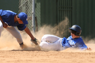 Julian Hart of Pali Blue slides into third during the PPBA's Pony Division quarterfinals last Saturday.