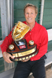 Former Los Angeles Dodgers first baseman Wes Parker proudly displays his all-time Rawlings Gold Glove trophy in the dugout at the Palisades Recreation Center's Field of Dreams.