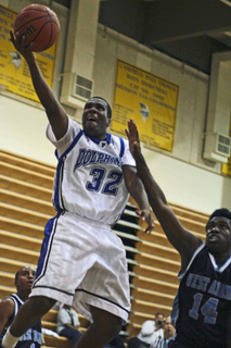 Aaron Fitts drives to the basket in Palisades' 86-54 win over West Adams in pool play of the Campbell Hall Tournament last Wednesday.
