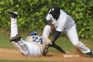 First baseman Phillip Joseph applies the tag to a Poly runner on a pick-off attempt in last Friday's season opener at George Robert Field. Palisades won 6-0.