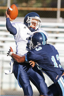 Sophomore linebacker Elmer Garcia sacks the Reseda quarterback in the second quarter of Friday