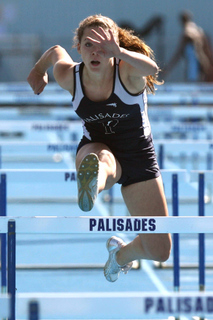 Erika Martin on her way to winning the hurdles at last Friday's track meet at Stadium by the Sea.