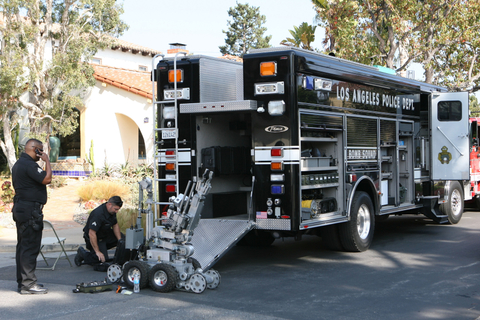 Rich Schmitt/Staff Photographer LAPD Bomb squad officers prepare the robot.