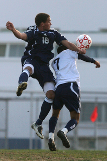 Charlie Bailey goes airborne against a Venice defender in the Dolphins' Western League opener, which ended in a 0-0 tie.